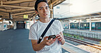 Man, check phone and waiting at train station with reading, thinking and location with digital schedule. Man, travel and smartphone for transportation app, time management or map for tourism in Japan