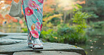 Walking, lake or legs of woman in nature for journey on holiday vacation for freedom or wellness. Park, travel or feet of Japanese person on rocks for health, peace and inspiration to relax in forest