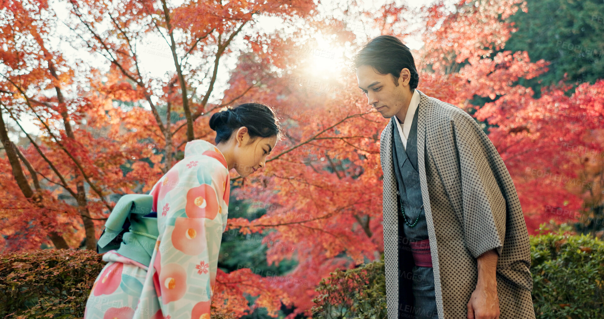 Buy stock photo People in park in Japan, bow and traditional clothes with hello, nature and sunshine with respect and culture. Couple outdoor together in garden, greeting with modesty and tradition, polite and kind