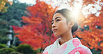 Woman in park, Asian and peace, thinking about life with reflection and tranquility in traditional clothes. Travel, Japanese garden and nature for fresh air, inspiration or insight with floral kimono