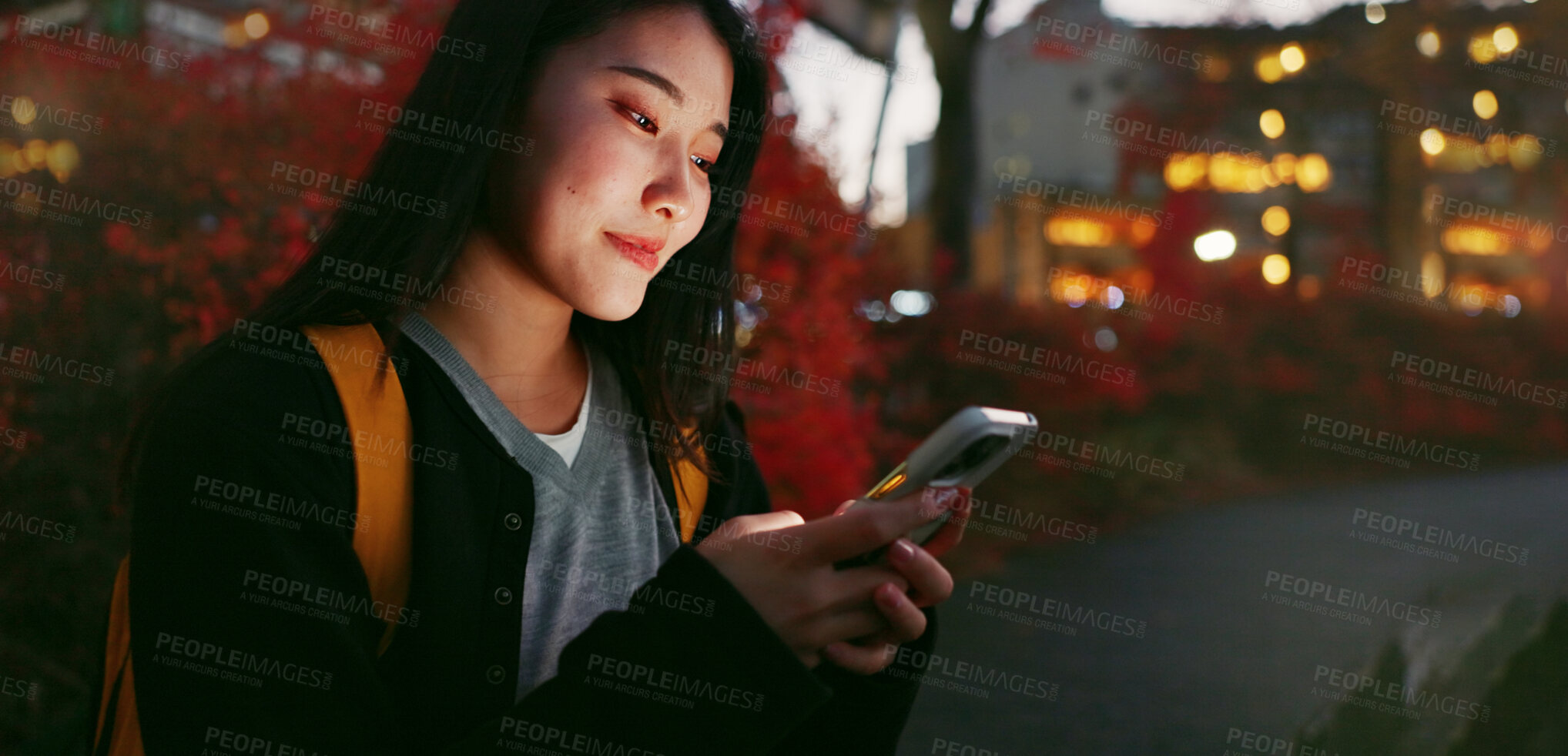 Buy stock photo Happy asian woman, phone and night for communication, social media or outdoor networking in city. Female person relax on mobile smartphone in late evening for online chatting in urban town of Japan