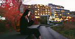 Asian woman, phone and night at city for social media, communication or outdoor networking. Female person relax on mobile smartphone in the late evening for online chatting in urban town of Japan