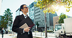 Walking, city and Asian business man with tablet, documents and file for morning commute in urban town. Professional, corporate worker and person thinking on travel for career, work and job in Japan