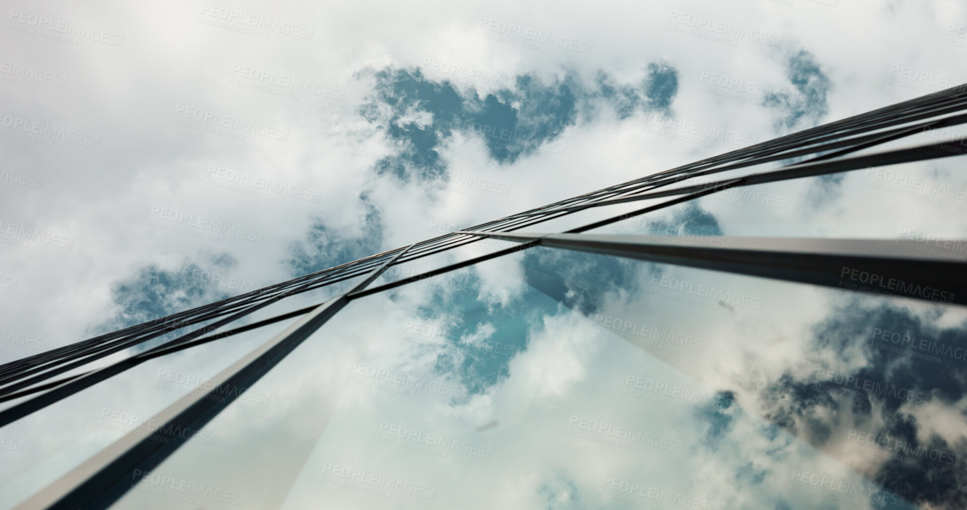 Buy stock photo Low angle, skyscraper building and clouds in city with reflection, nature and urban infrastructure. Architecture, cityscape and skyline and metro with landscape, glass and sky background in timelapse