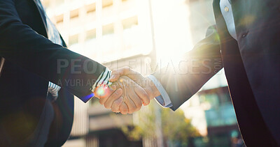 Business people, handshake and city for partnership, agreement or greeting in outdoor deal or meeting. Closeup of employees shaking hands outside for b2b, teamwork or hiring in an urban town together