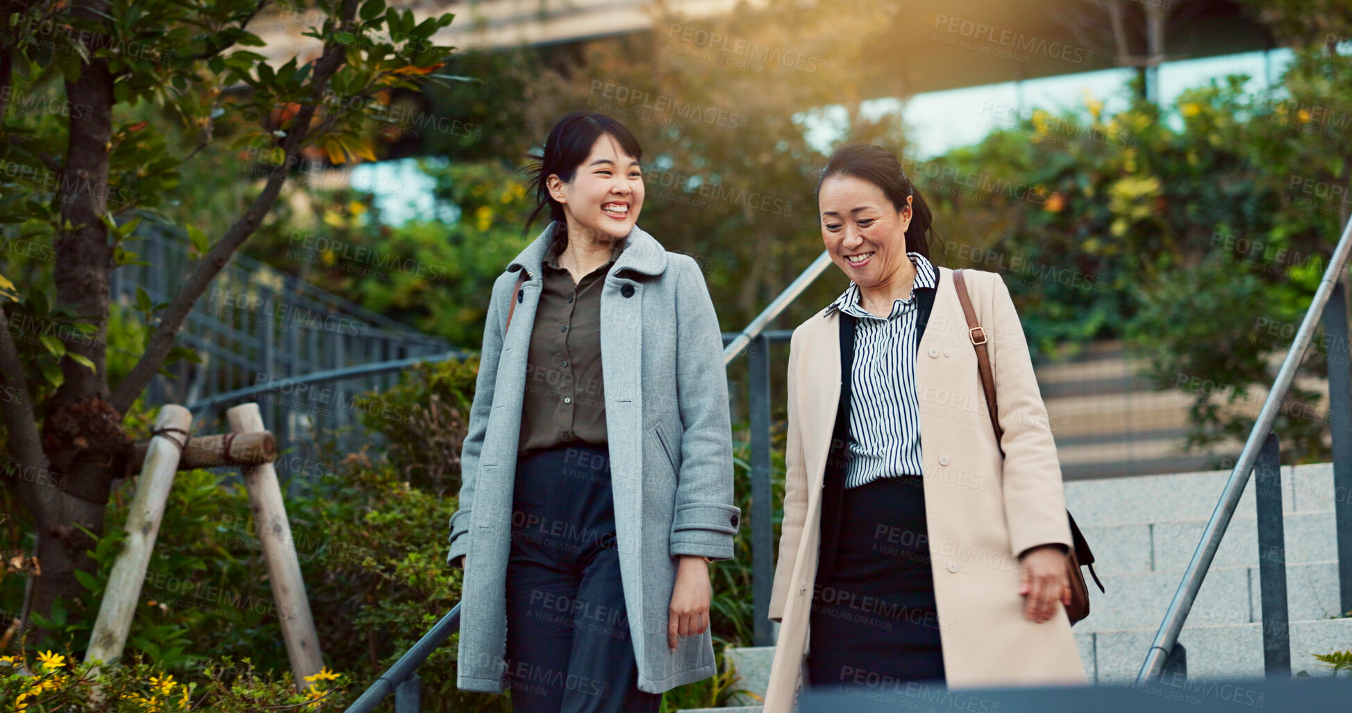 Buy stock photo Walking, conversation and business women in the city talking for communication or bonding. Smile, discussion and professional Asian female people speaking and laughing together commuting in town.
