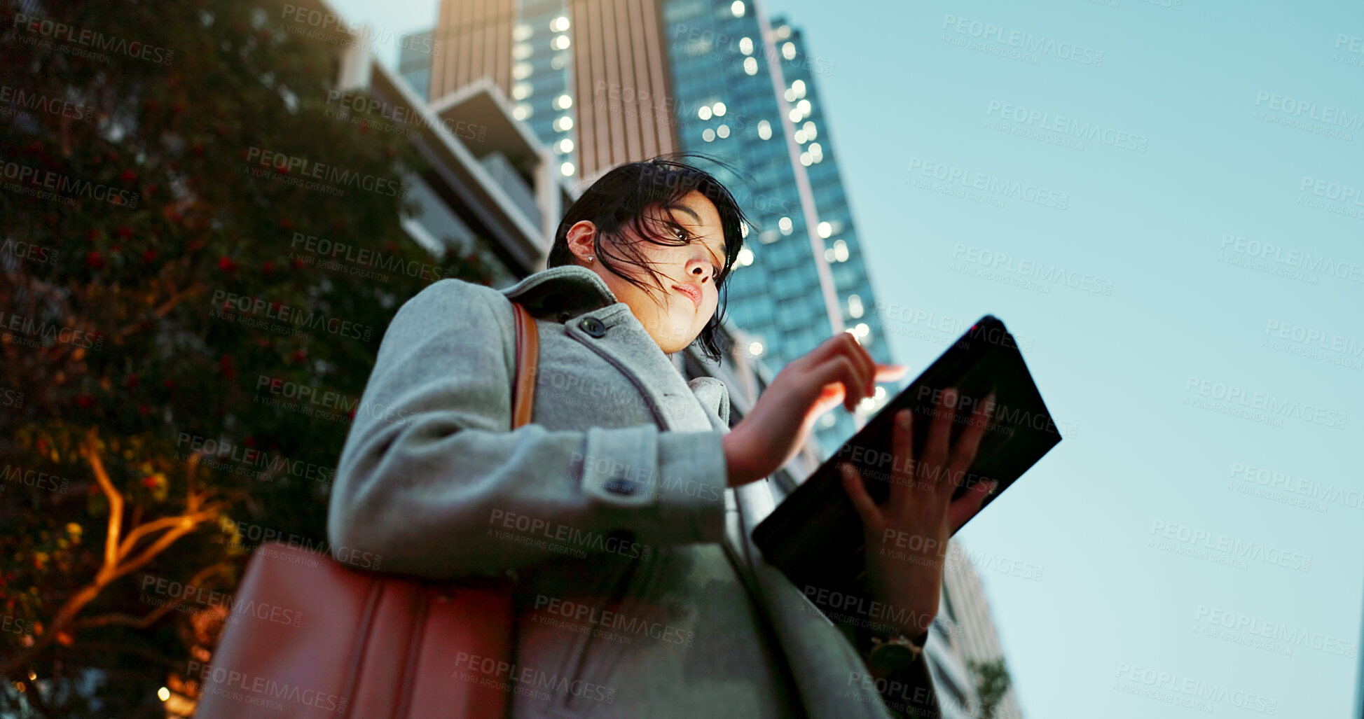 Buy stock photo Asian woman, tablet and city for communication, research or social media by building in Japan. Female person or employee on technology for online search, chat or outdoor networking in an urban town