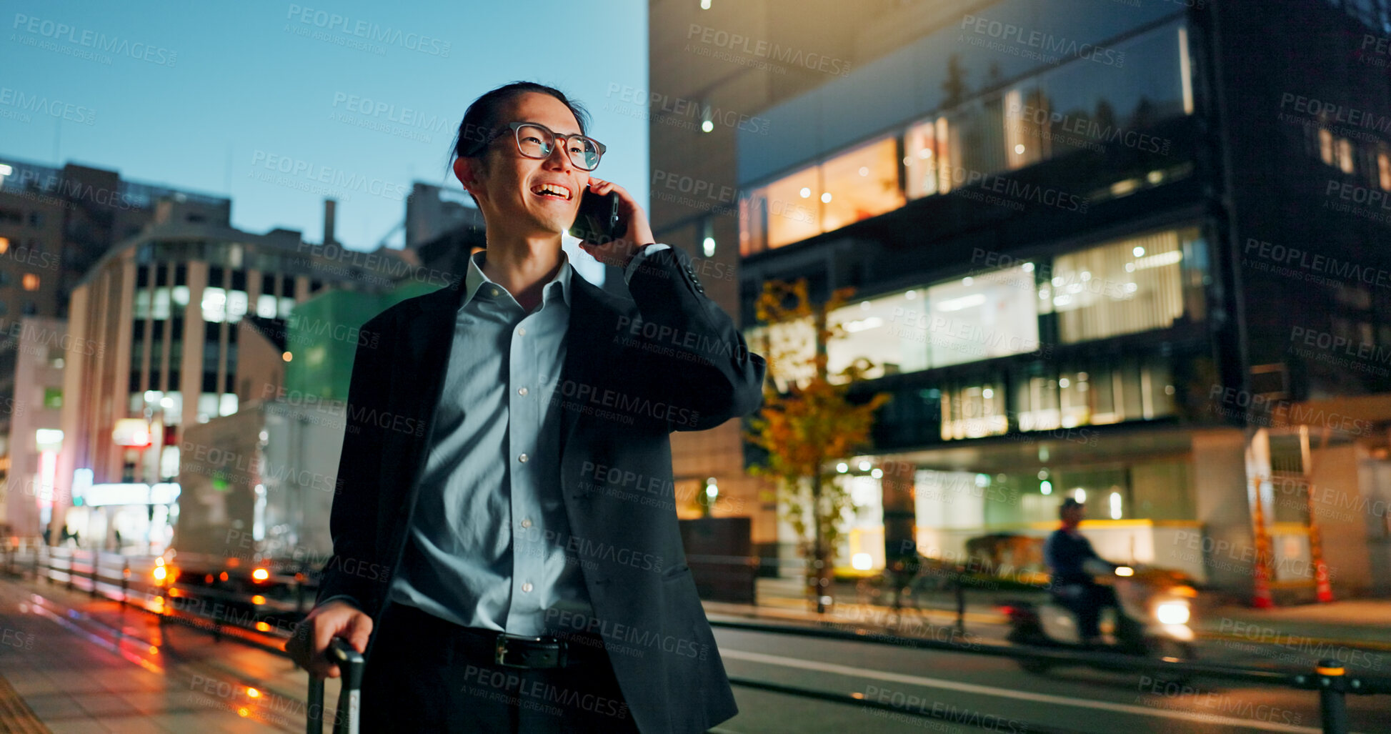 Buy stock photo Businessman, phone call and night in city for conversation, laughing or outdoor travel. Happy asian man or employee smile and talking on mobile smartphone in late evening for discussion in urban town