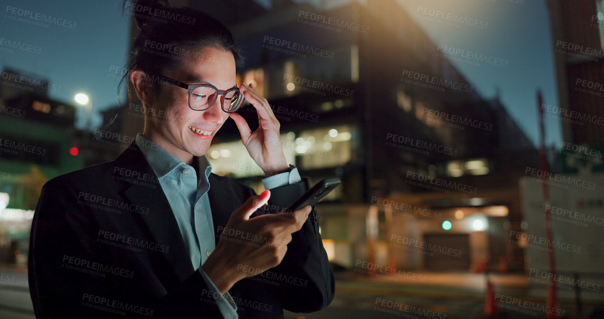 Buy stock photo Phone, night and Asian businessman in the city networking on social media, mobile app or internet. Technology, smile and young professional male person with cellphone for research in town at night.