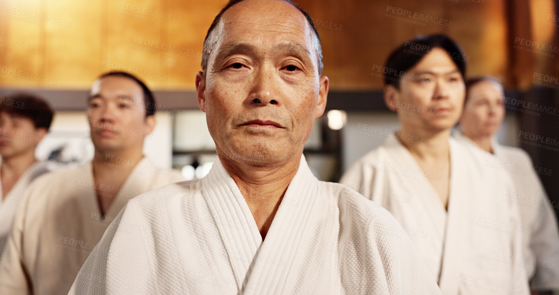 Buy stock photo Aikido class, students or portrait for martial arts, sensei or ready for training, gym or group in dojo. Japanese people, sport or exercise in club, workout or fitness for fight, black belt or battle
