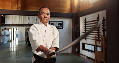 Buy stock photo Japanese master, aikido or martial arts by sword, lesson in combat or teacher of self defence. Sensei, black belt or katana in dojo place, sport or weapon demonstration by mature fighter to students