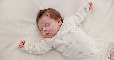 Buy stock photo Cute, sleeping and newborn baby on a bed at a home in the bedroom for resting and dreaming. Tired, sweet and top view of infant, child or kid taking a nap in the morning in nursery at family house.