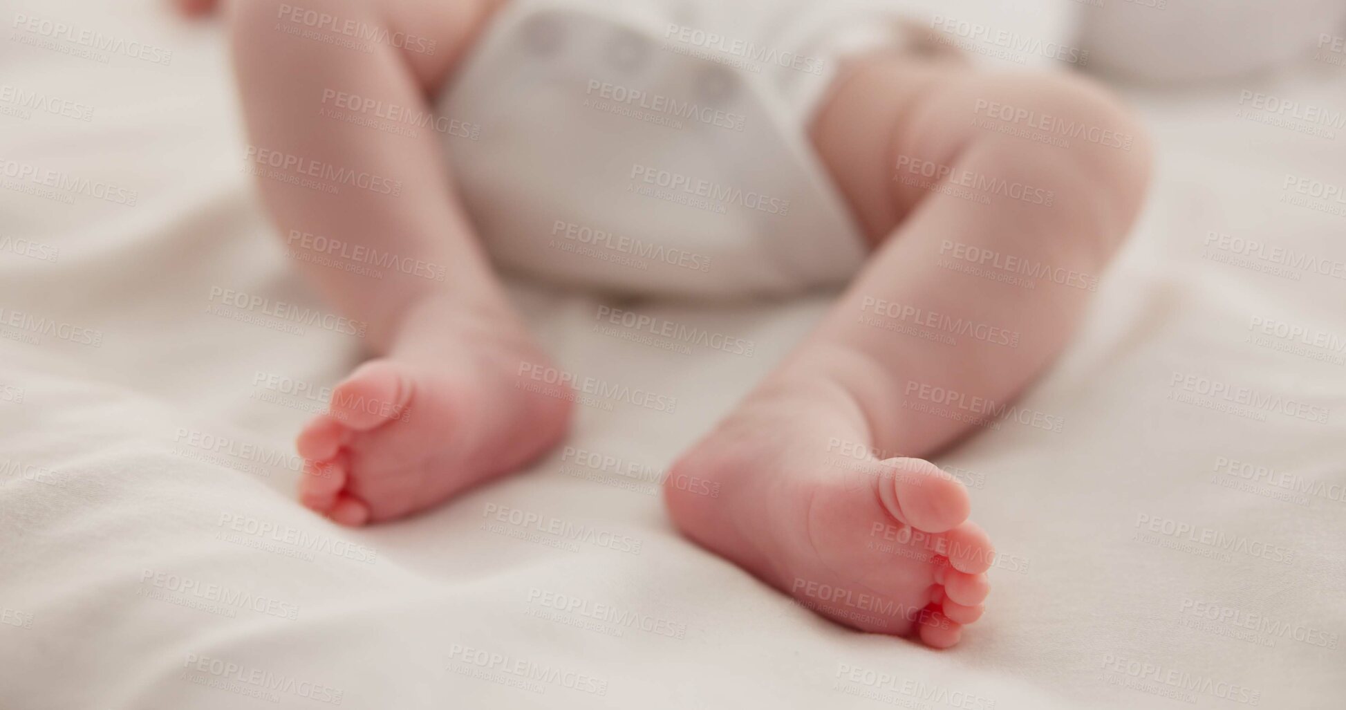 Buy stock photo Sleeping, adorable and feet of baby on bed for child care, dreaming and relax in nursery. Family, cute and closeup of toes of innocent newborn infant for health, wellness and development at home