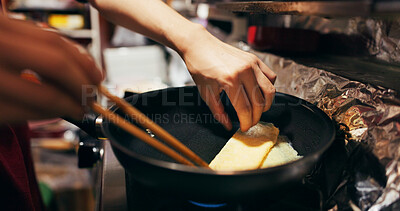 Buy stock photo Cooking, chopsticks and person with egg in pan at market for frying food for meal preparation, eating and nutrition. Culinary, flame and closeup of chef prepare lunch, cuisine dinner and supper