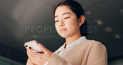Buy stock photo Phone, studio or Japanese businesswoman on social media texting or typing an email in online conversation. Research, mobile app or female employee on website to chat for post or networking on break