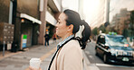 Coffee, walking and Japanese business woman in the city crossing the road to work or job. Cappuccino, travel and professional young female person commuting with caffeine in the morning in urban town.