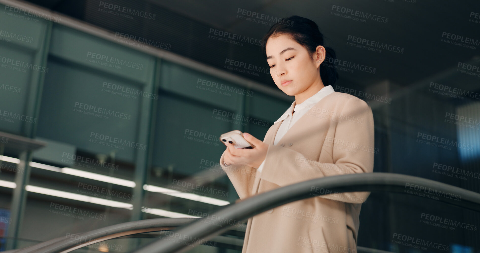 Buy stock photo Japanese, escalator and travel with businesswoman, phone or social media with internet, employee or convention. Person, consultant or worker with airport, communication or connection with mobile app