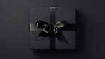Box, gift and present with bow on black background for surprise prize giving, celebration or party event. Bow, ribbon, wrapping paper and package for Christmas, birthday or special day giveaway.