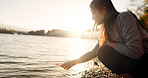 Japanese woman, red maple leaf and Lake Kawaguchi with game, thinking or memory in nature, adventure or holiday. Girl, plant and sunrise for vacation by forest, environment or waves by water in Tokyo