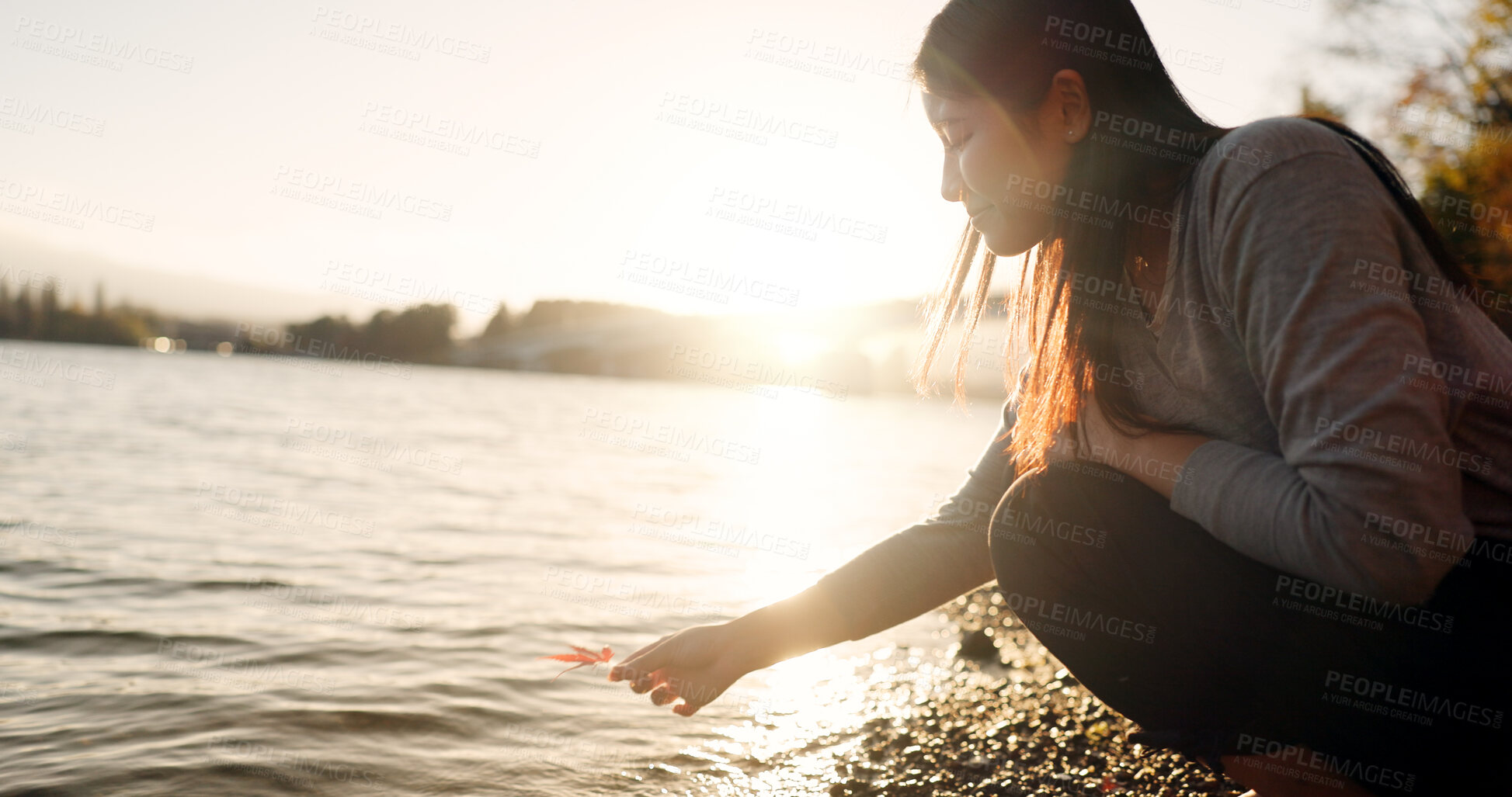 Buy stock photo Japanese woman, red maple leaf and Lake Kawaguchi with game, thinking or memory in nature, adventure or holiday. Girl, plant and sunrise for vacation by forest, environment or waves by water in Tokyo