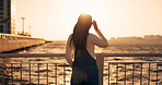 Back, woman and sea with sunset and view of horizon outdoor, travel and tourism with peace, calm and nature. Environment, ocean and traveller on adventure or journey, sunshine and wind in Kyoto