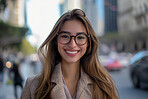 Portrait, street business and woman in the city for freelancer, commute and urban travel. Happy, confident and young female entrepreneur walking and smiling for exploration, leadership and corporate