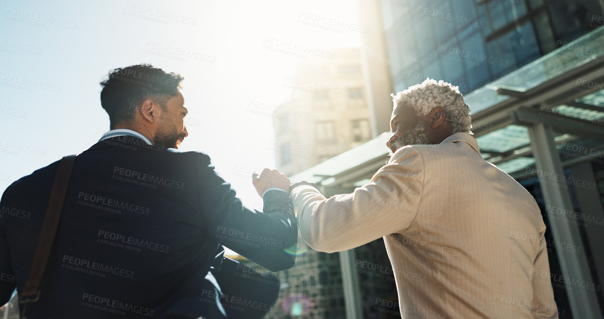 Buy stock photo Business men, fist bump and team in street with smile, support and respect on walk to investment company. Partnership, friends and staff with hello, happy and commute on city sidewalk in Cape Town