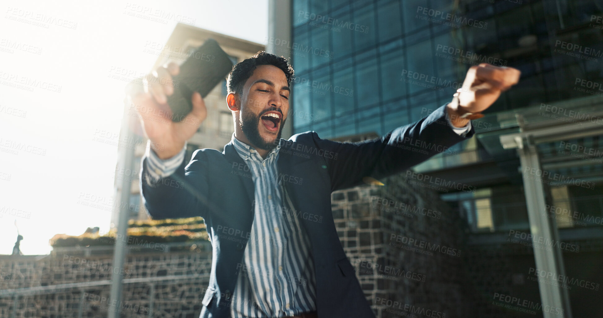 Buy stock photo Phone, dance and success with a businessman in the city for increase, bonus or promotion celebration. Wow, mobile and a winner young employee cheering for goals, target or corporate achievement