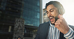 Happy, dance and businessman with headphones in city for job promotion celebration with phone. Smile, cellphone and excited professional young male person listening to music, radio or album in town.