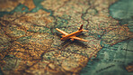 World map, adventure and background with toy plane for travel, freedom or vacation. Objects, destination and planning with illustration on table for wellness, motivation or discovery in nature