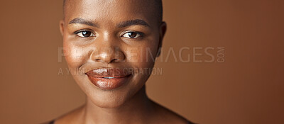 Face, beauty and smile with happy black woman in studio isolated on brown background for wellness. Portrait, skincare and aesthetic for foundation cosmetics or dermatology with a natural bald person