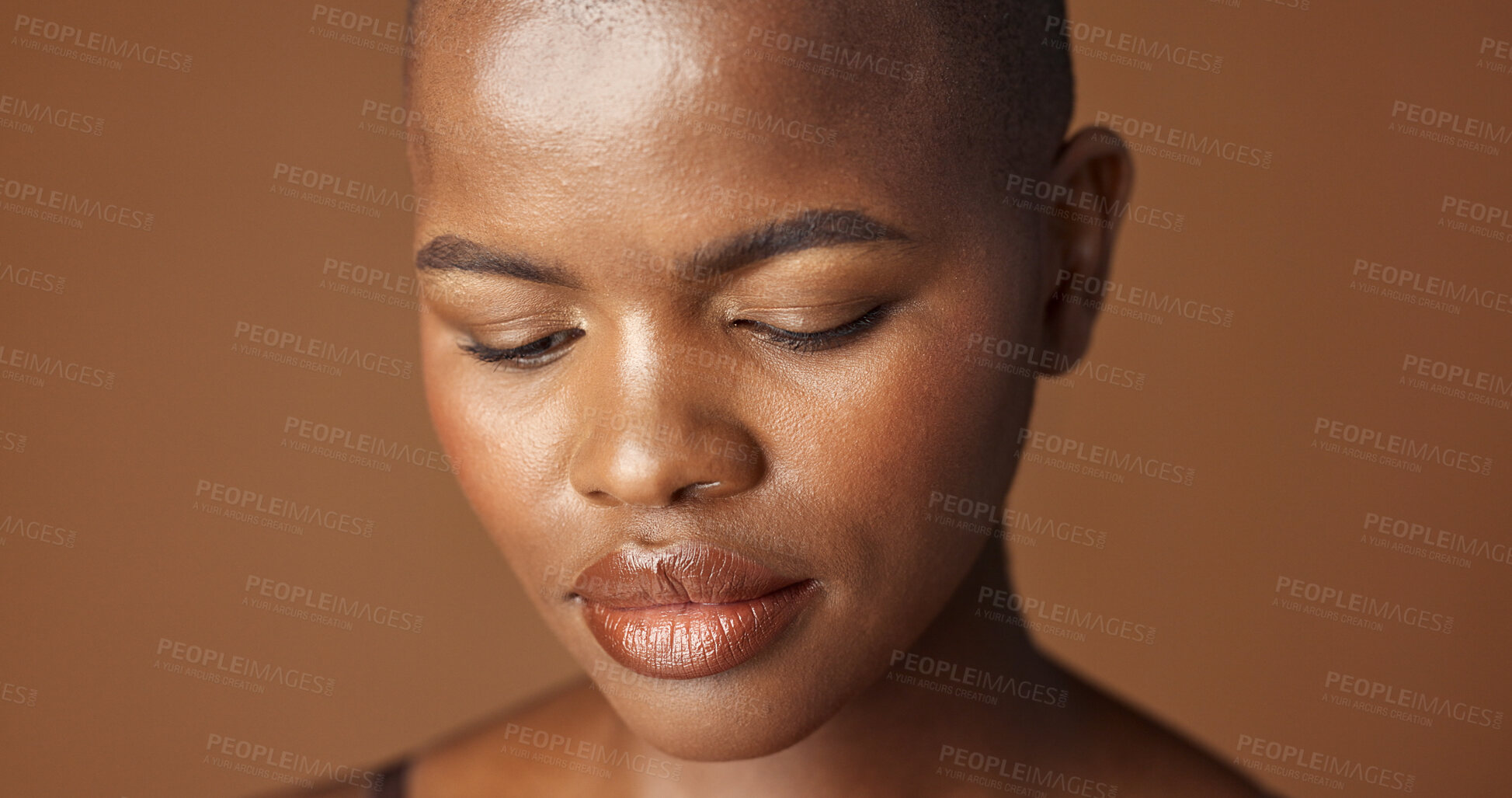 Buy stock photo Face, skincare and aesthetic with happy black woman in studio isolated on brown background for wellness. Portrait, beauty and smile for foundation cosmetics or dermatology with a natural bald person