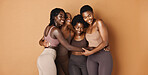 Hug, face or African models with skincare, glowing skin or results isolated on brown background. Facial dermatology, friends or natural beauty cosmetics in studio with black women or happy people
