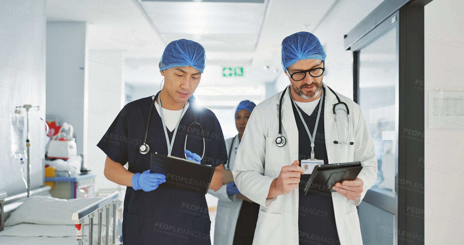 Buy stock photo Teamwork, talking and doctors with a tablet at a hospital for health advice or surgery communication. Help, clinic and medical employees speaking with technology, planning and schedule for nursing