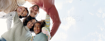 Buy stock photo Face, happy family and bottom hug outdoor for care, love or bonding on vacation, holiday and low angle. Smile, portrait of parents and children embrace together, having fun or enjoying quality time