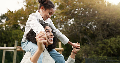 Mother, daughter and piggyback walking in park or garden for fun bonding, holiday or weekend outside. Happy mom carrying her child on shoulders for family time together in nature or forest by house