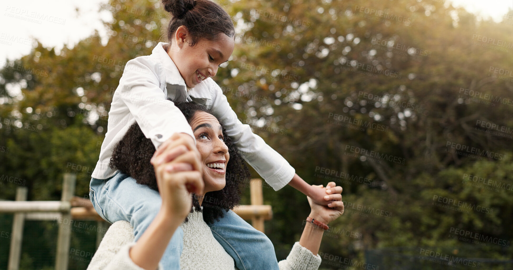 Buy stock photo Mother, daughter and piggyback walking in park or garden for fun bonding, holiday or weekend outside. Happy mom carrying her child on shoulders for family time together in nature or forest by house