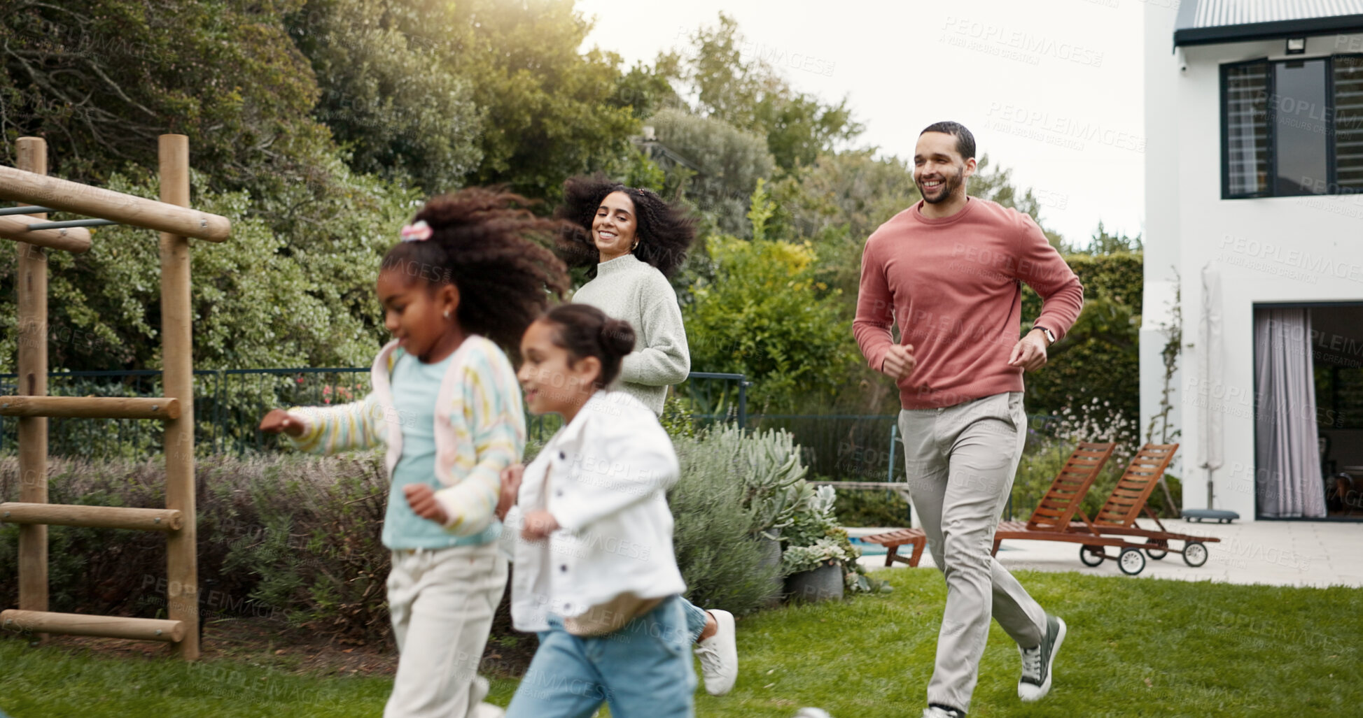 Buy stock photo Family, running and children outdoor in backyard for playing, happiness and bonding at home. Young latino woman, man and happy kids at a playground while on holiday or vacation for a fun activity