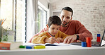 Father, boy child and homework with laptop, writing and helping hand for education, childhood development or care. Man, dad and male kid with home school, notebook and computer with teaching at desk