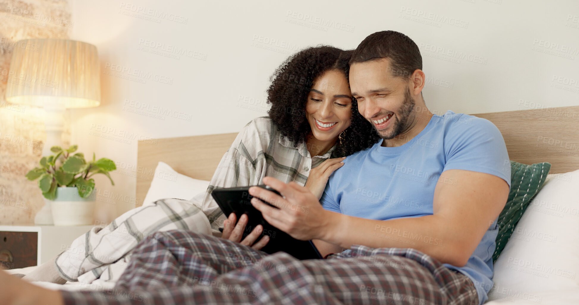 Buy stock photo Couple, tablet and laughing in bed, morning and bond with funny video, movie or meme for love, care or hug. Man, woman and digital touchscreen for typing, comic social network or online game in house