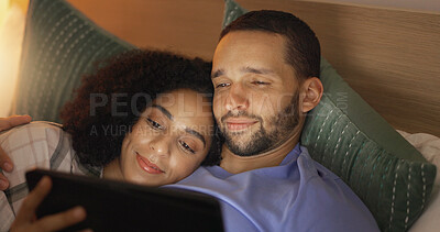 Couple, smile and relax in bedroom with tablet at night, streaming movie or film. Happy, technology and man and woman in bed on social media, browsing online app and watching video together in home