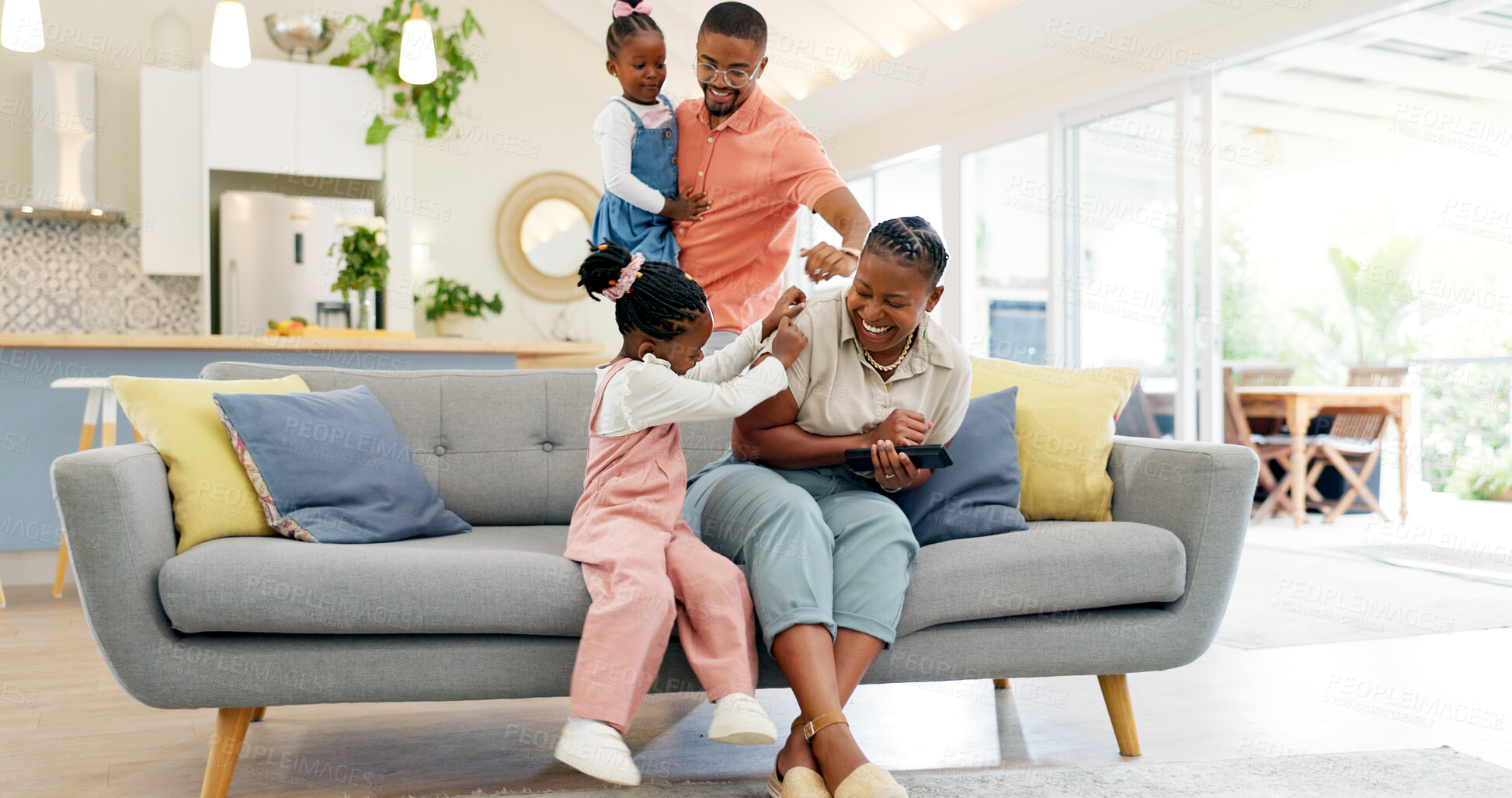 Buy stock photo Happiness, playful parents and kids on sofa, black family having fun and smile in home together. Mother, father and young children playing on couch in living room, happy playing with love and support