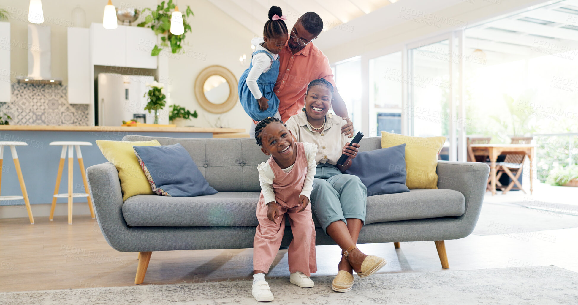 Buy stock photo Happiness, playful parents and kids on sofa, black family having fun and smile in home together. Mother, father and young children playing on couch in living room, happy playing with love and support