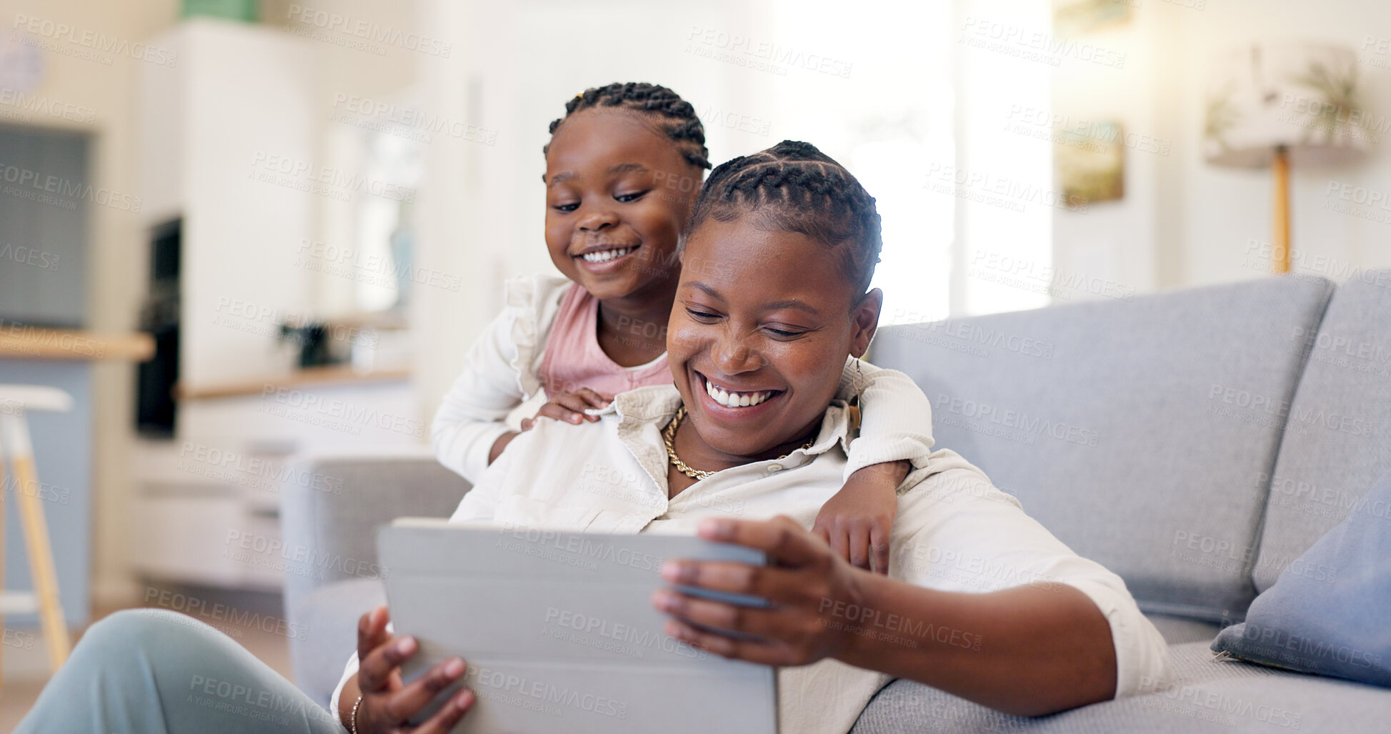 Buy stock photo Family, woman with child and with tablet in living room of their home for social media. Technology or internet, streaming movie or bonding time and black mother with her daughter together happy