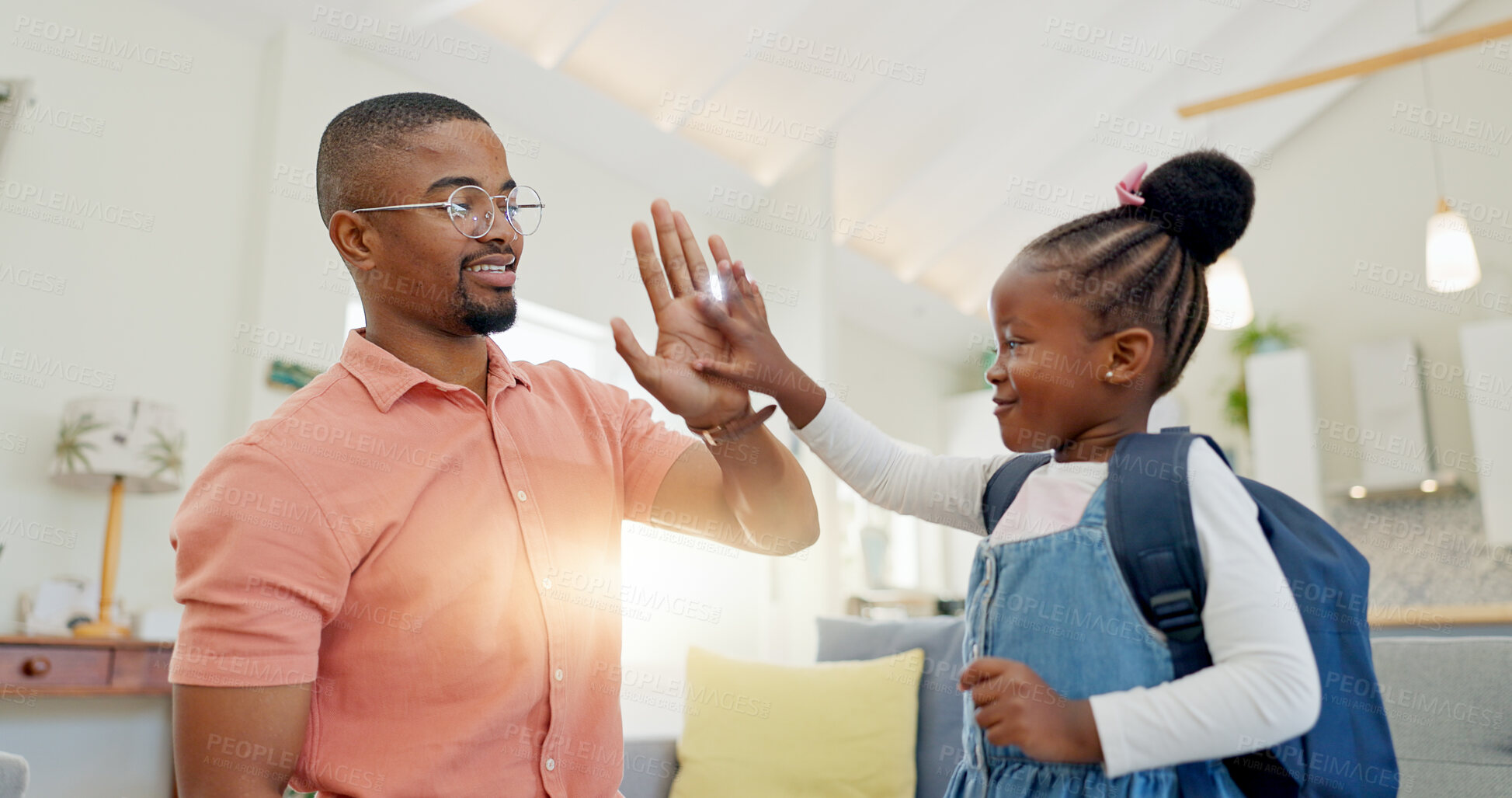 Buy stock photo Black family, education and girl with backpack for school, kindergarten and high five from dad for support and motivation. Child, student and father helping to get ready and leave house in morning