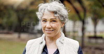 Portrait, senior woman and smile in the park with happiness in nature, woods or outdoor for a walk in retirement. Happy, face and elderly person with wellness from exercise or healthy workout