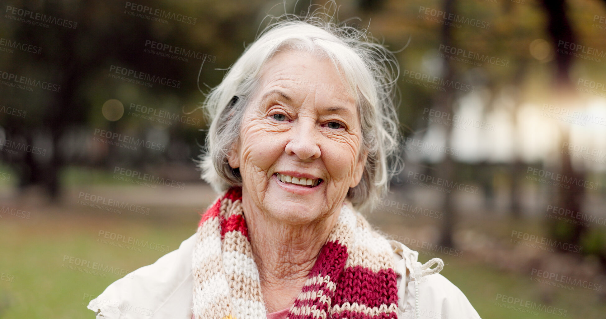 Buy stock photo Senior woman with a smile, portrait in the park and happiness in nature, woods or outdoor for a walk in retirement. Happy, face and elderly person with wellness from exercise or healthy workout