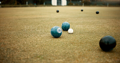 Green, balls and lawn bowling game on grass, field or pitch in a match or competition of outdoor bowls. Ball, moving and sport tournament at a bowlers club, league or championship games on the ground