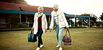 Retirement, hobby and senior woman friends walking on a field at the bowls club together for a leisure activity. Smile, talking and elderly people on the green of a course for bonding or recreation