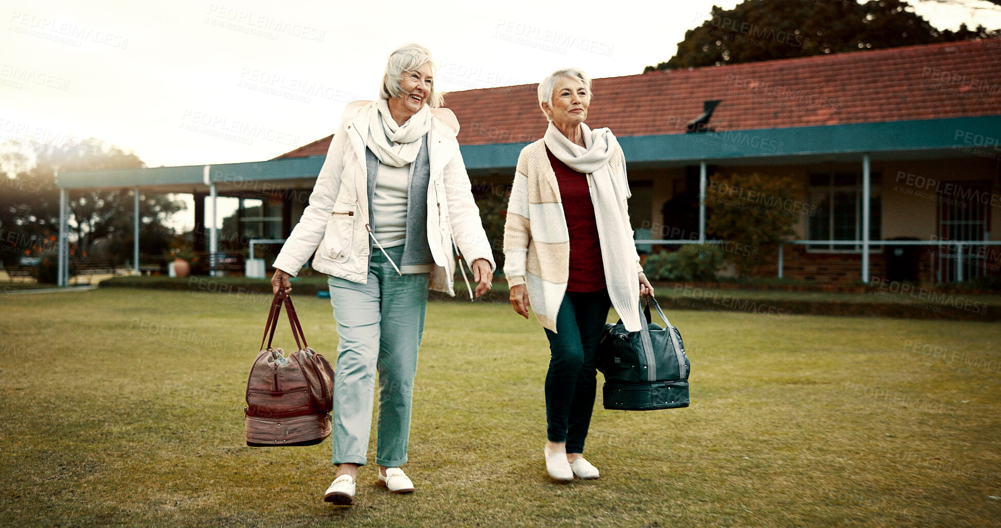 Buy stock photo Retirement, hobby and senior woman friends walking on a field at the bowls club together for a leisure activity. Smile, talking and elderly people on the green of a course for bonding or recreation